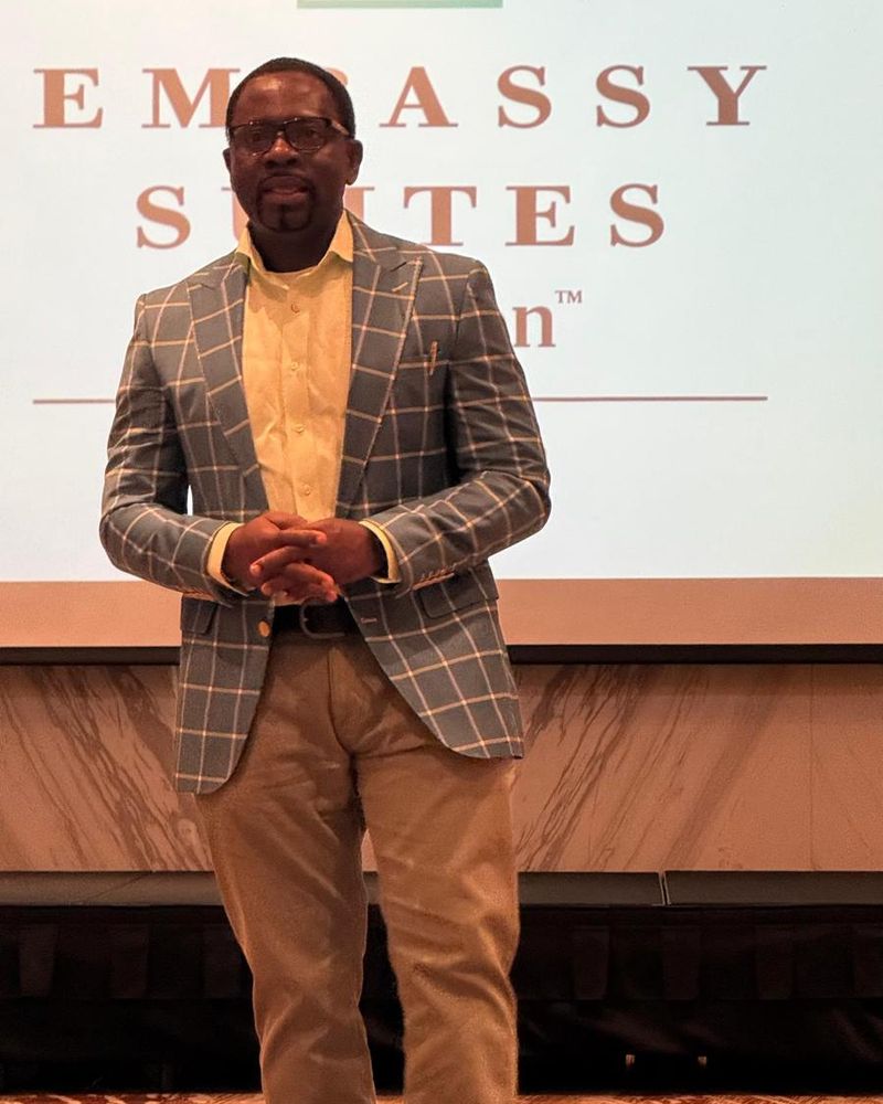 NG Nwankwo walking on stage during a talk